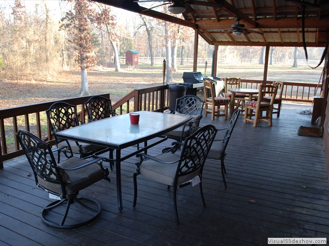Wrap around porch with dining for 10 or more, gas BBQ grill, and coleman cooktop