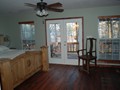 Master bedroom, bath, and king bed with a view of Lake Bob Sandlin and a private wrap around porch.<br/>