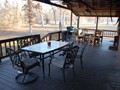 Wrap around porch with dining for 10 or more, gas BBQ grill, and coleman cooktop